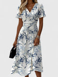 Damen Midikleid mit Wickeloptik, V-Ausschnitt, Blumenmuster und kurzen Ärmeln