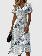 Damen Midikleid mit Wickeloptik, V-Ausschnitt, Blumenmuster und kurzen Ärmeln