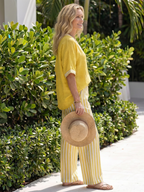 Completo da donna a due pezzi a righe con pantaloni a gamba larga