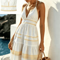 Women's Halterneck Knee-Length Dress with V-Neck and Tiered Skirt Design