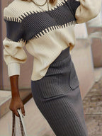 Completo da donna con maglione in maglia a coste e gonna midi