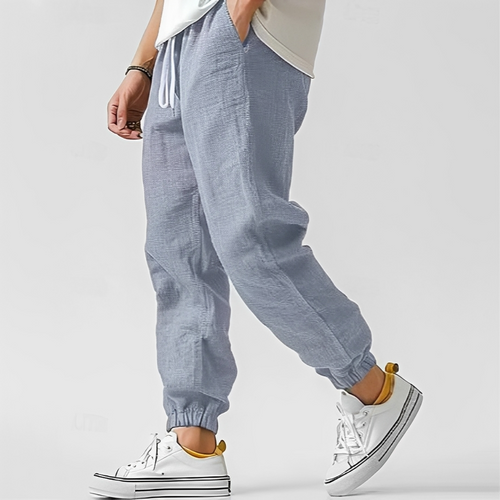Pantalon jogger fuselé à taille élastique avec cordon et poches pour homme