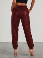Pantalones jogger elegantes de cuero sintético para mujer