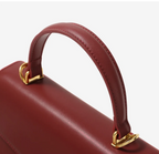 Borsa da donna strutturata con patta e manico superiore