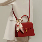 Borsa da donna strutturata con patta e manico superiore