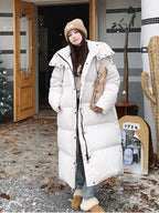 Manteau long matelassé à capuche pour femme
