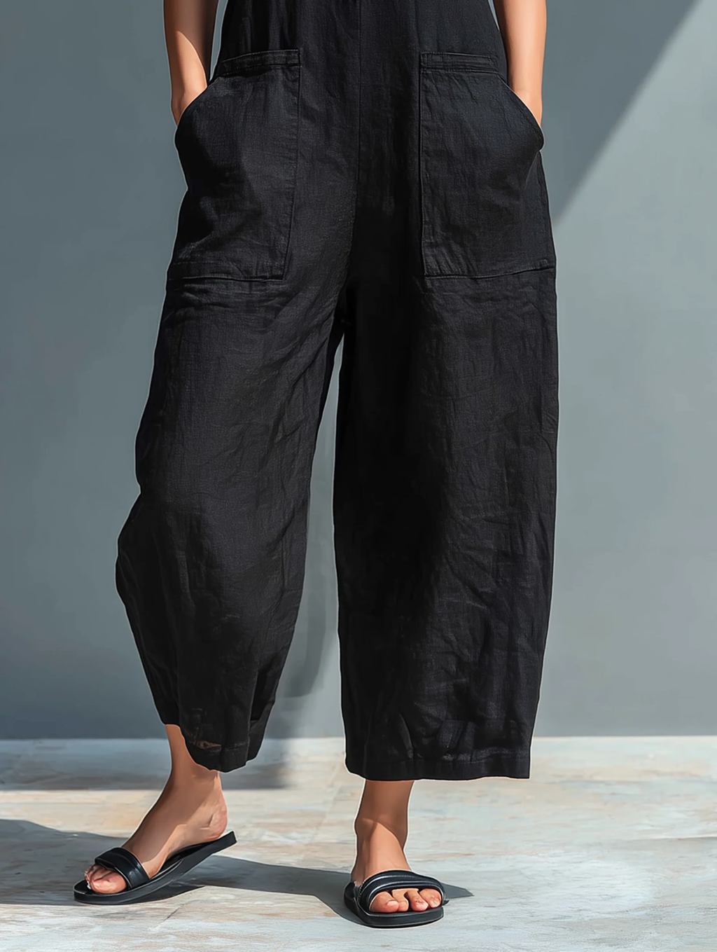 Damen minimalistischer ärmelloser Jumpsuit mit Knopfleiste vorne und entspannter Passform