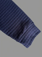 Polo à manches longues texturé pour homme avec fermeture à boutons quart de zip
