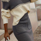 Completo da donna con maglione in maglia a coste e gonna midi