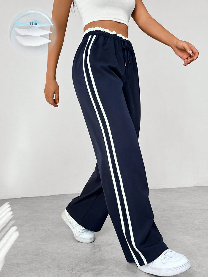 Pantalon de survêtement rayé pour femme à jambes larges